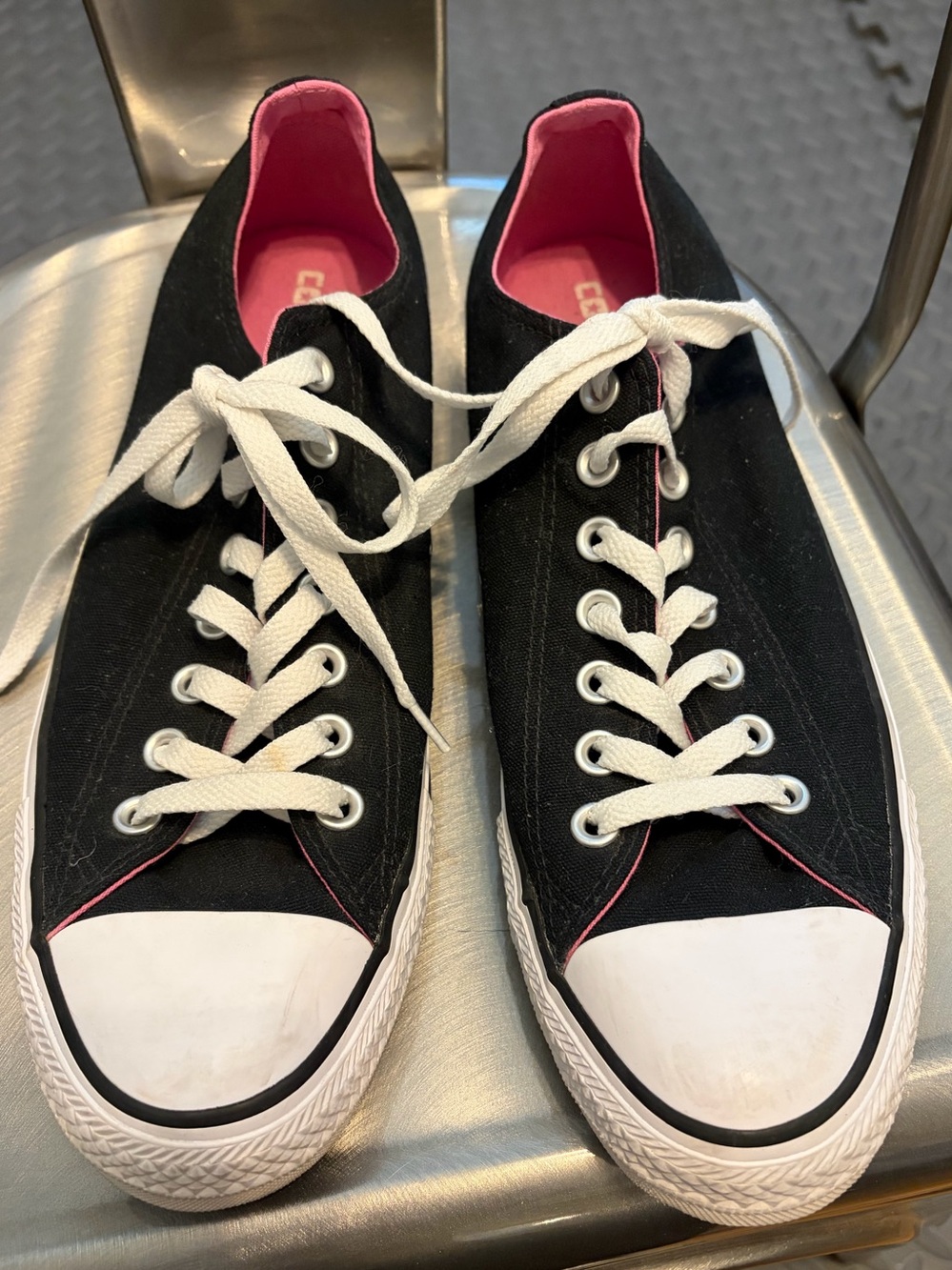 Converse All Star Womens size 11. Low top. Black and white, floral tongue.